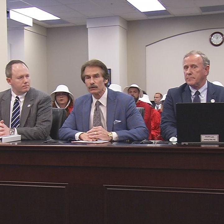 Lawmakers discuss abortion bills with protesters in background